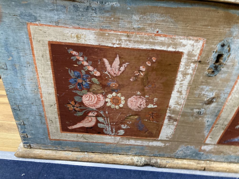 A Swiss blue / floral painted pine coffer, width 110cm depth 62cm height 56cm